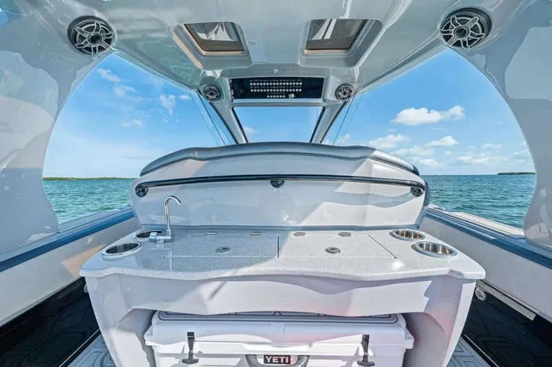 Slide: The Image of Interior view of 2025 Deep Impact 369 Sport boat with ocean backdrop. - 39