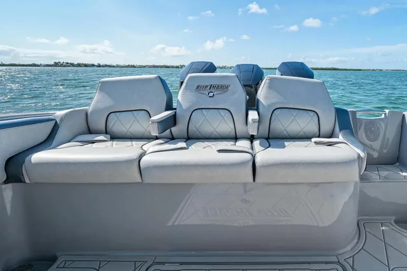 Slide: The Image of Luxury seating on 2025 Deep Impact 369 Sport boat, ocean backdrop. - 45