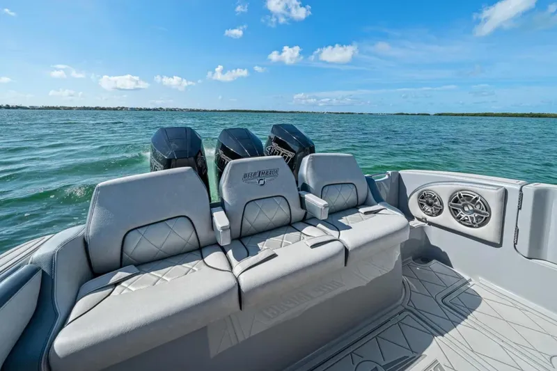 Slide: The Image of 2025 Deep Impact 369 Sport boat with luxurious seating on open water. - 47
