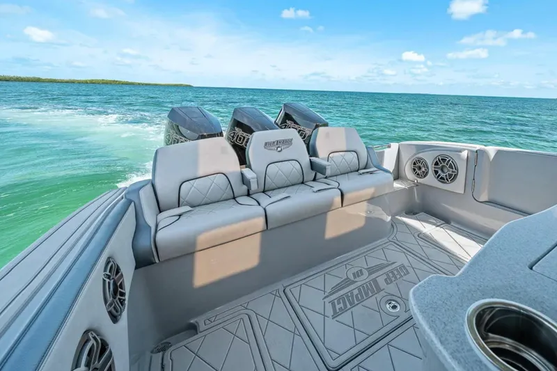 Slide: The Image of 2025 Deep Impact 369 Sport boat interior with luxurious seating and ocean view. - 48