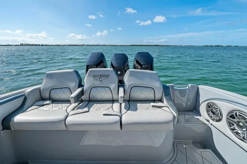 Slide: The Image of 2025 Deep Impact 369 Sport boat with luxurious seating on open water. - 49
