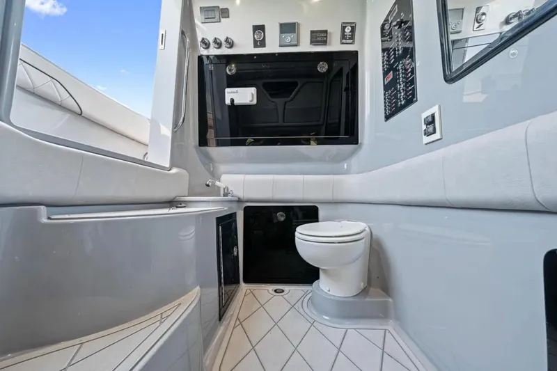 Slide: The Image of Luxurious bathroom interior of 2025 Deep Impact 369 Sport boat, featuring modern amenities. - 52