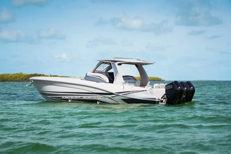 Slide: The Image of 2025 Deep Impact 369 Sport boat on calm water, featuring sleek design and powerful engines. - 58