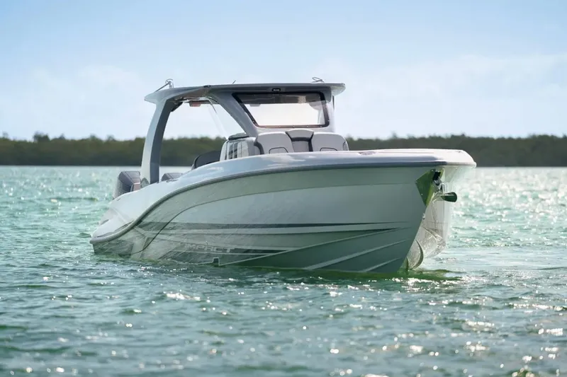 Slide: The Image of 2025 Deep Impact 369 Sport boat on calm water, showcasing sleek design and modern features. - 59