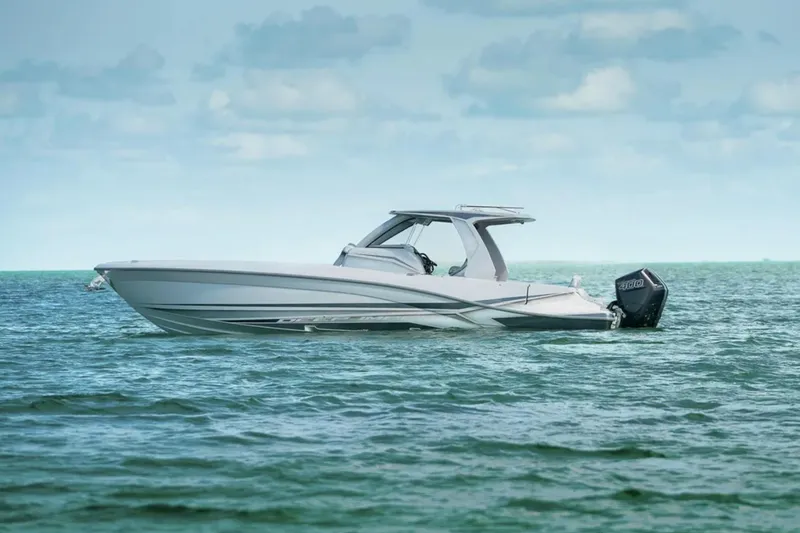 Slide: The Image of 2025 Deep Impact 369 Sport boat on calm ocean waters. - 63