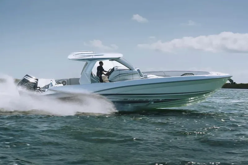 Slide: The Image of 2025 Deep Impact 369 Sport boat speeding on open water. - 7