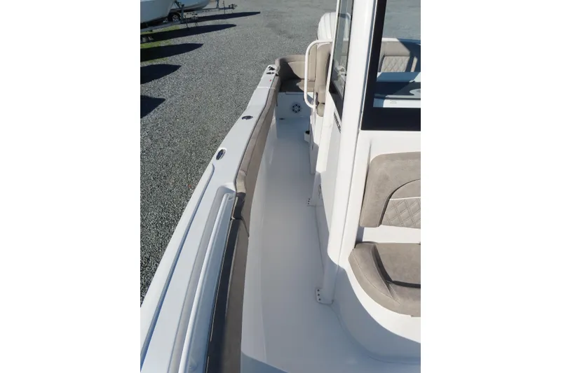 Slide: The Image of 2025 Sea Hunt Ultra 245 SE boat interior with cushioned seating and sleek design. - 15