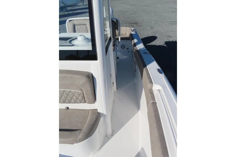 Slide: The Image of 2025 Sea Hunt Ultra 245 SE boat interior with cushioned seating and sleek design. - 16