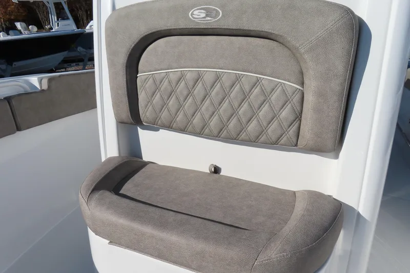 Slide: The Image of 2025 Sea Hunt Ultra 245 SE boat seat with gray cushioned upholstery. - 17