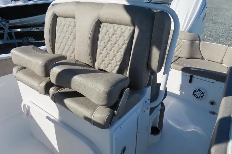 Slide: The Image of 2025 Sea Hunt Ultra 245 SE boat seating with cushioned, diamond-stitched design. - 20