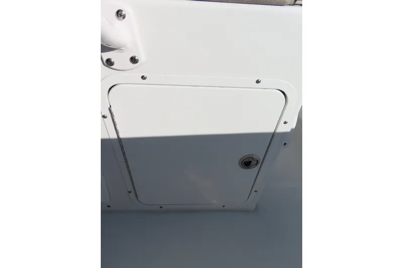 Slide: The Image of 2025 Sea Hunt Ultra 245 SE boat compartment with secure latch. - 27