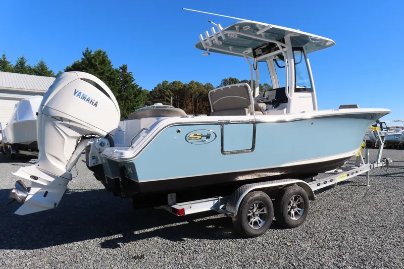 Slide: The Image of 2025 Sea Hunt Ultra 245 SE boat on trailer with Yamaha outboard motor. - 3