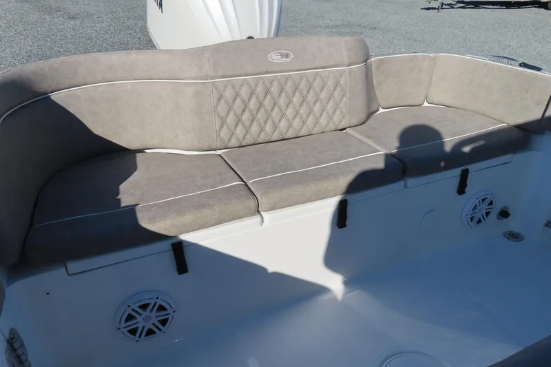 Slide: The Image of 2025 Sea Hunt Ultra 245 SE boat seating with beige upholstery and diamond stitching. - 35