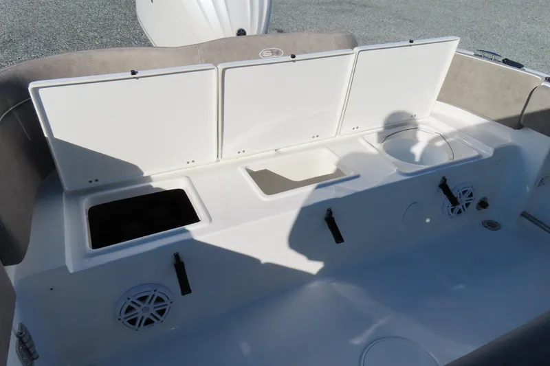 Slide: The Image of 2025 Sea Hunt Ultra 245 SE boat interior with storage compartments and speakers. - 37
