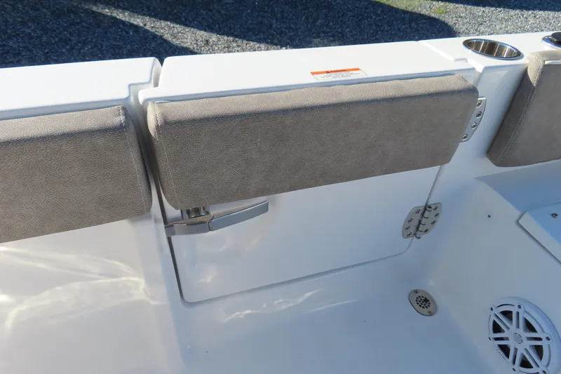 Slide: The Image of 2025 Sea Hunt Ultra 245 SE boat interior with cushioned seating and cup holders. - 41