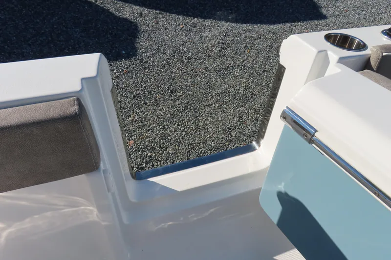 Slide: The Image of 2025 Sea Hunt Ultra 245 SE boat interior detail with seating and cup holders. - 42