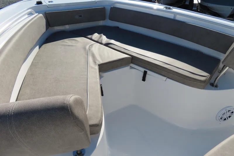 Slide: The Image of 2025 Sea Hunt Ultra 245 SE boat interior with cushioned seating. - 7