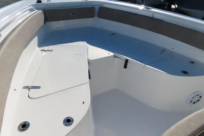 Slide: The Image of 2025 Sea Hunt Ultra 245 SE boat interior with storage compartments and seating. - 8
