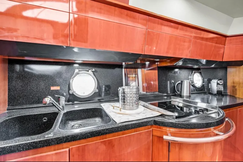 Slide: The Image of Luxurious kitchen interior of 2006 Azimut Fly yacht with modern appliances and sleek design. - 12