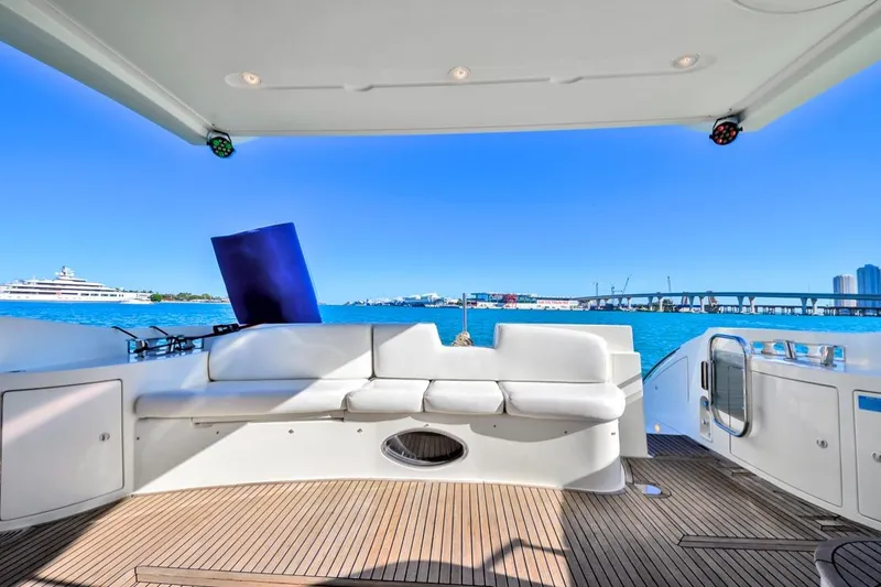 Slide: The Image of Luxurious 2006 Azimut Fly yacht deck with white seating, overlooking serene blue waters. - 15