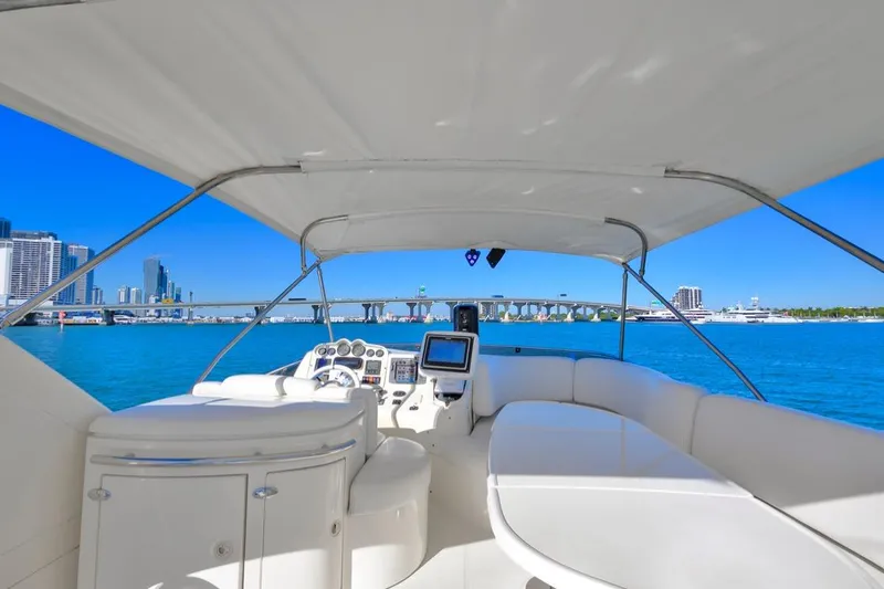 Slide: The Image of 2006 Azimut Fly yacht interior with city skyline and bridge in the background. - 16