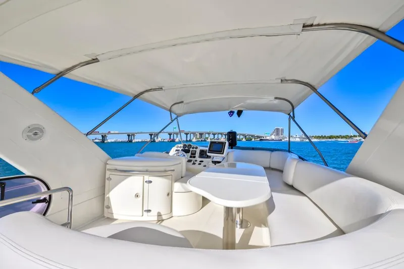 Slide: The Image of Luxurious 2006 Azimut Fly yacht interior with ocean view and modern navigation equipment. - 26
