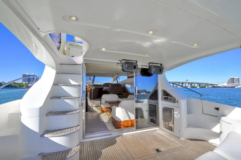 Slide: The Image of 2006 Azimut Fly yacht interior with modern design, spacious seating, and ocean view. - 7