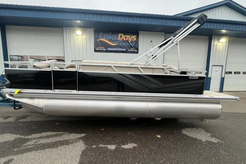 The Image of 2026 Avalon VTX Quad Fish pontoon boat parked outside Lake Days Marine. - 1