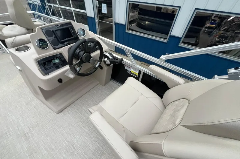 Slide: The Image of 2026 Avalon VTX Quad Fish boat interior with steering wheel and control panel. - 18