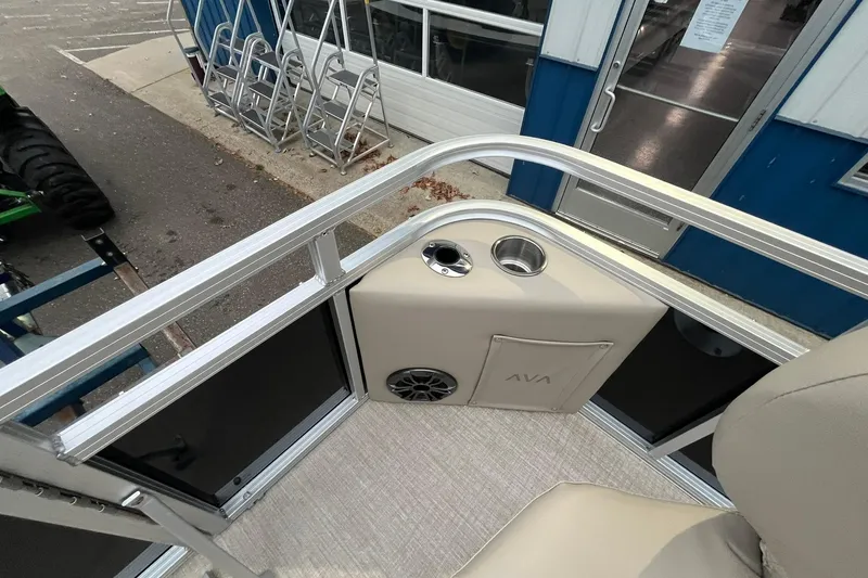 Slide: The Image of 2026 Avalon VTX Quad Fish boat interior with cup holders and speaker. - 22