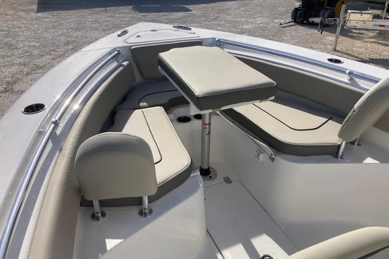 Slide: The Image of 2026 Key West 239 FS boat interior with cushioned seating and table. - 10