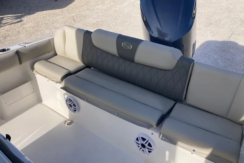 Slide: The Image of 2026 Key West 239 FS boat interior with cushioned seating and speaker system. - 13