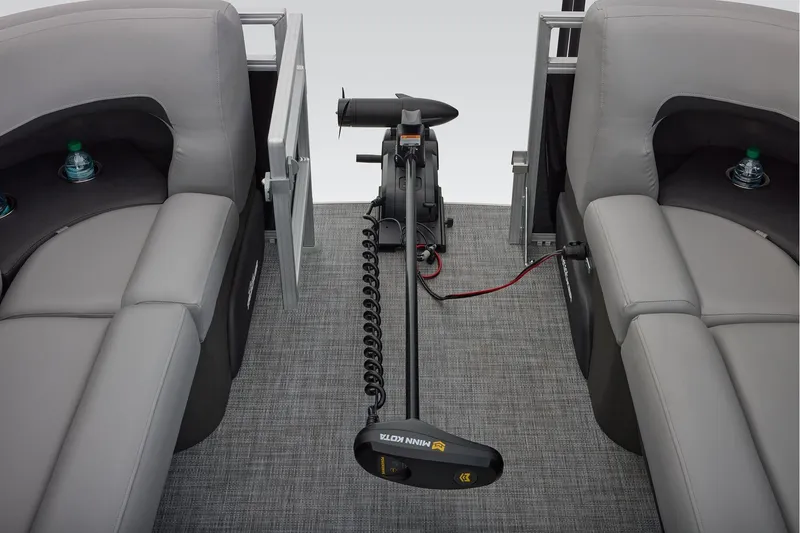 Slide: The Image of 2026 Sun Tracker SportFish 22 DLX boat interior storage compartment with open door. - 22