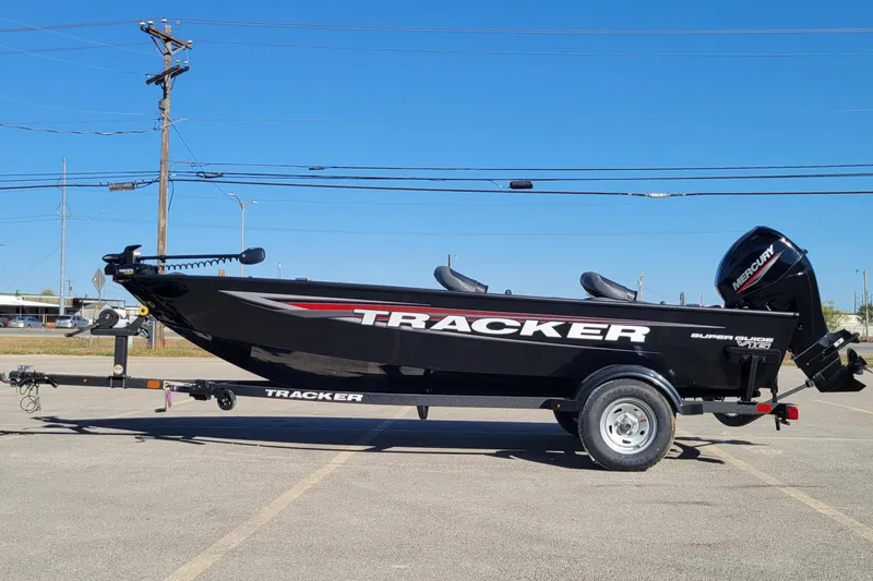 The Image of 2026 Tracker Super Guide V-16 T boat on trailer in parking lot. - 0
