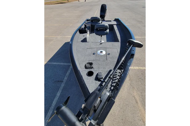 Slide: The Image of 2026 Tracker Super Guide V-16 T fishing boat in a parking lot. - 3