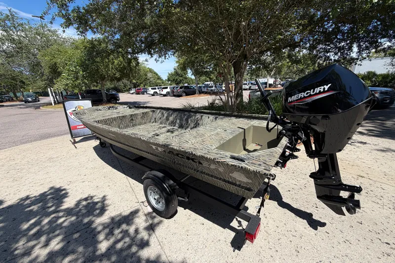 The Image of 2026 Tracker Grizzly 1648 Utility boat with Mercury engine, parked outdoors. - 0