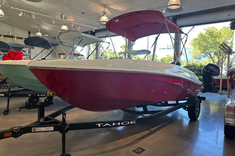 The Image of 2026 Mako Pro Skiff 19 CC boat displayed indoors on a trailer. - 0