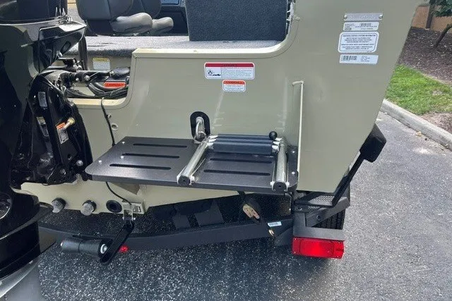 Slide: The Image of 2026 Tracker Targa V-18 Combo boat with foldable ladder and motor mount. - 15