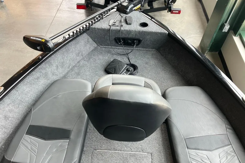 Slide: The Image of 2026 Tracker Pro Guide V-175 Combo boat interior with seating and trolling motor. - 4