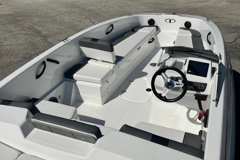 Slide: The Image of 2026 Tahoe T18 boat interior with sleek seating and modern steering console. - 4