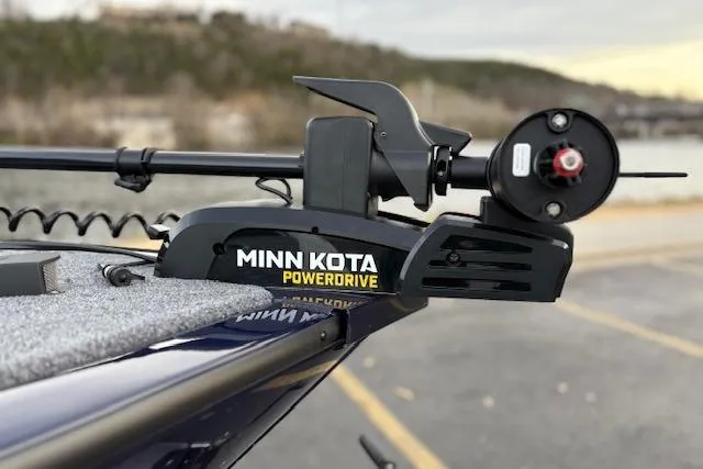 Slide: The Image of Minn Kota PowerDrive on 2026 Tracker Pro Guide V-175 WT boat, docked outdoors. - 77