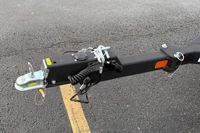 Slide: The Image of Trailer hitch of 2026 Tracker Pro Guide V-175 WT on asphalt surface. - 78