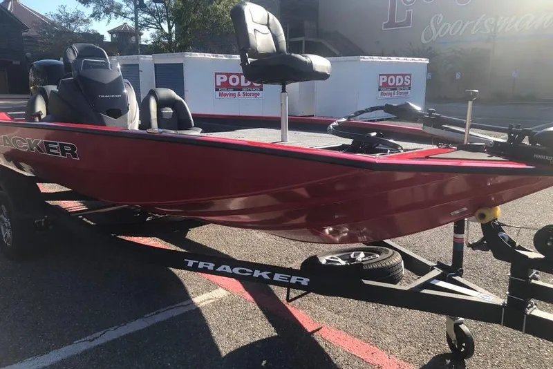 Slide: The Image of 2026 Tracker Pro Team 195 boat on trailer, parked outdoors in sunlight. - 5