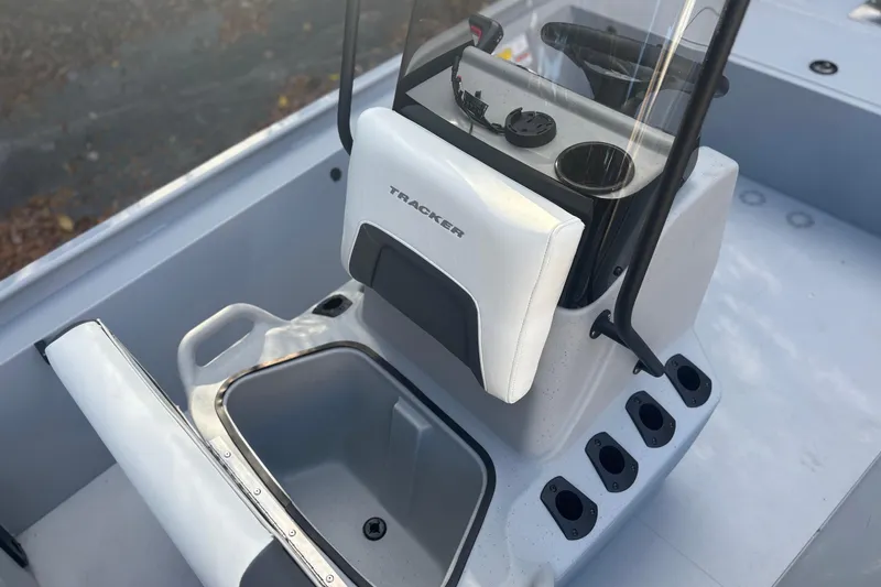 Slide: The Image of 2026 Tracker Bass Tracker Classic CC boat console with steering wheel and cup holders. - 6
