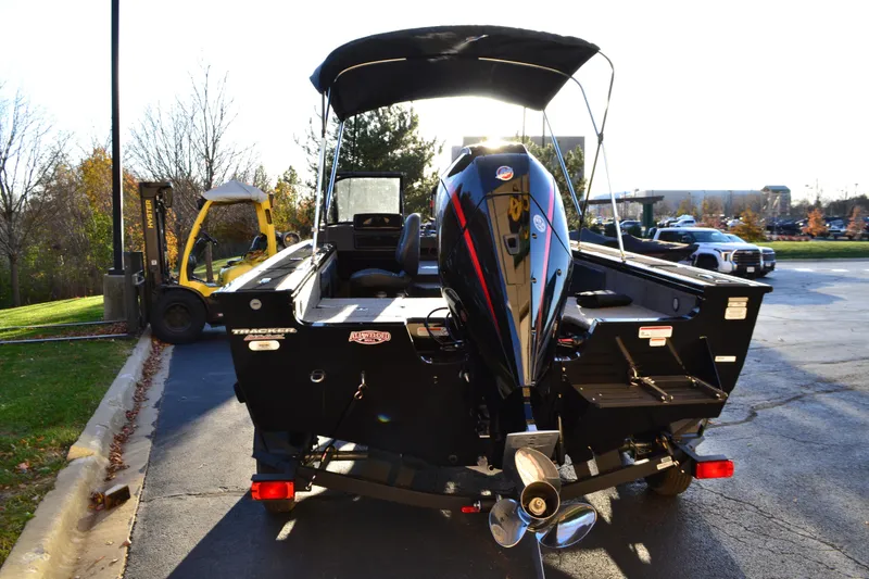 Slide: The Image of 2026 Tracker Targa V-19 Combo boat on trailer, side view, beige color. - 2
