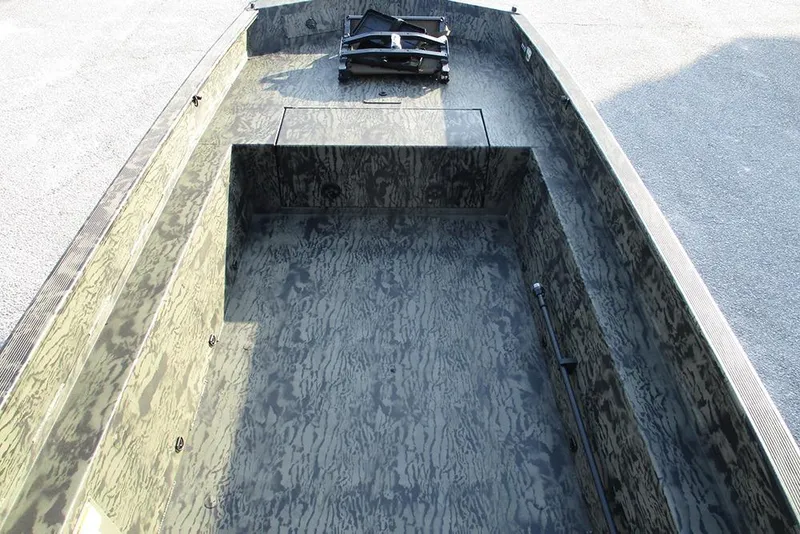 Slide: The Image of 2026 Tracker Grizzly 1650 T Prairie Wings Edition boat interior with camouflage design. - 10