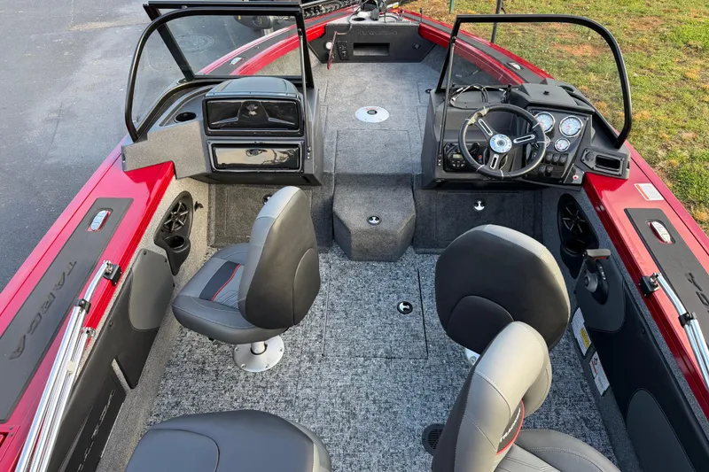 Slide: The Image of 2026 Tracker Targa V-19 Combo boat on trailer, side view, beige color. - 2