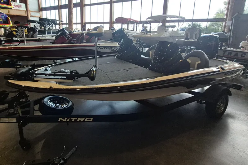 Slide: The Image of 2026 Nitro Z17 boat displayed indoors on a trailer. - 5