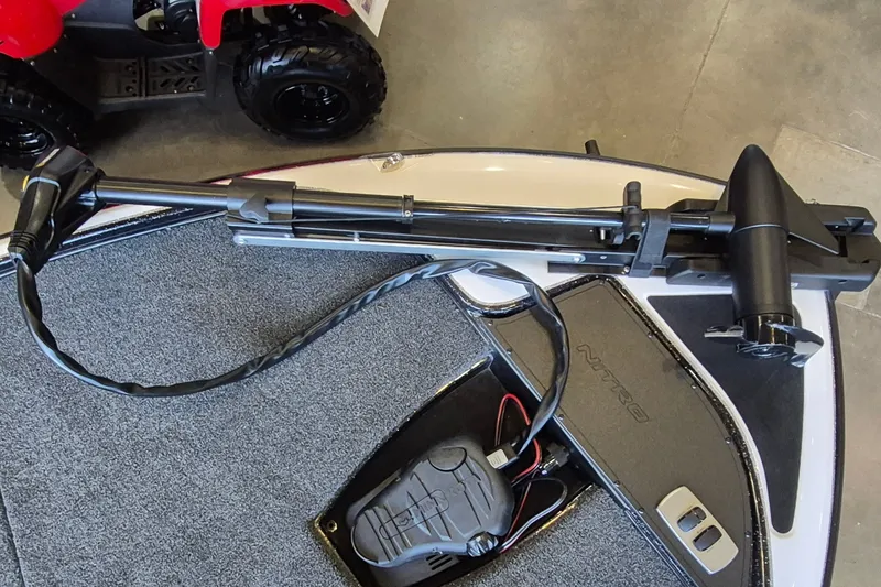 Slide: The Image of Trolling motor on a 2026 Nitro Z17 boat deck, featuring a foot pedal control. - 12