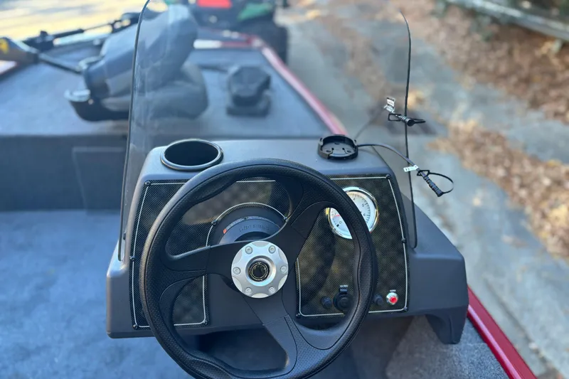 Slide: The Image of Steering console of 2026 Tracker Bass Tracker Classic XL boat with gauges and controls. - 7